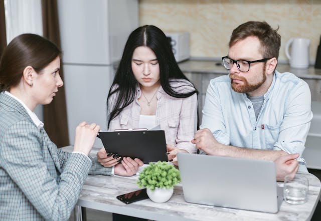 a picture of a couple getting legal and financial services for a funeral.