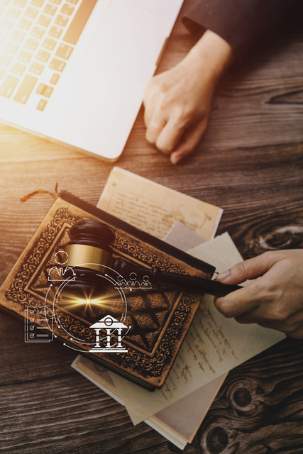 photo of a gavel and legal paperwork to describe end of life planning, life insurance and legal and financial services often used for estates.