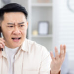 Photo of an angry man expressing how to choose the right funeral home and funeral home red flags.
