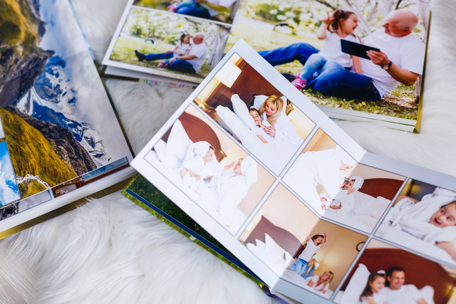 photo of photo albums and someone plans and creates their own DIY memorial.