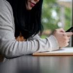 cropped photo of an Asian woman depicting text-based therapy