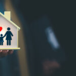 Illustration of a family protected inside a house with a red heart above them, symbolizing love, security, and life insurance for seniors.