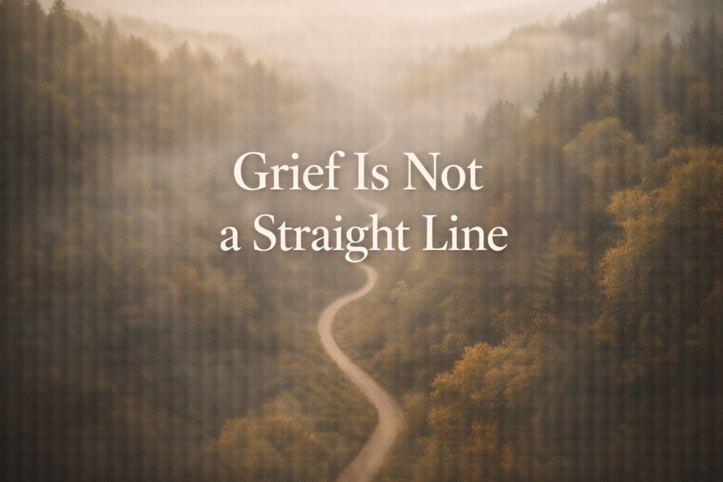 Winding path through a misty forest representing the nonlinear nature of grief and the dual process model of healing after loss