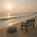 Peaceful beach scene with memorial bench and gentle waves representing the natural wave model of grief rather than rigid stages