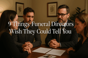 Compassionate funeral director discussing planning options with family in professional office setting
