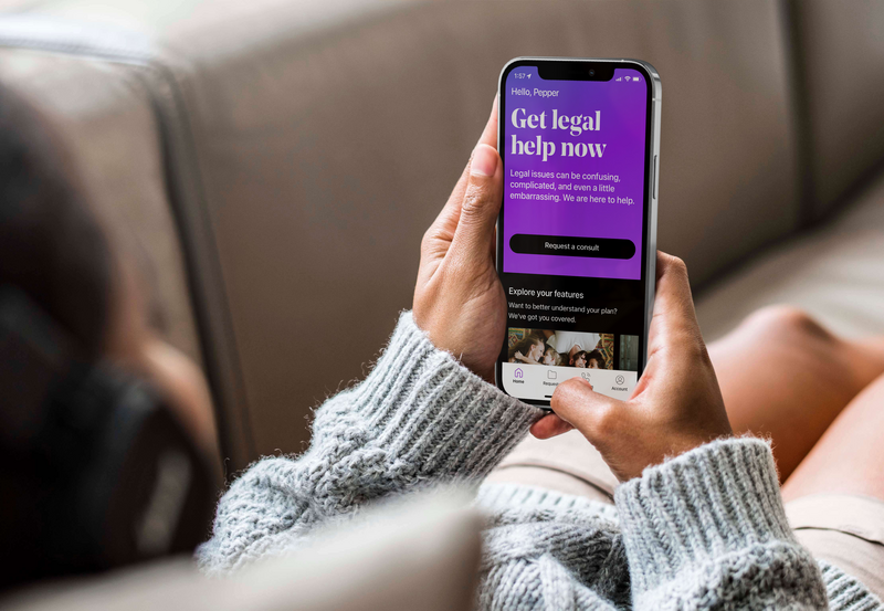Person using LegalShield mobile app to request legal consultation from home