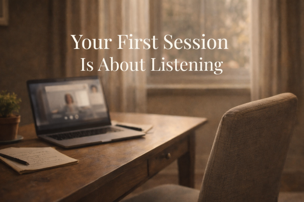 Calm home office space with laptop open to a video call, representing what an online grief therapy session environment looks like