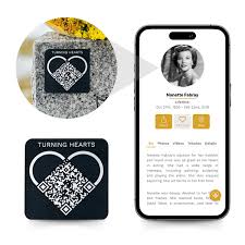 Turning Hearts aluminum QR memorial medallion on dark granite beside an iPhone displaying a loved one's digital memorial profile with photos and tributes
